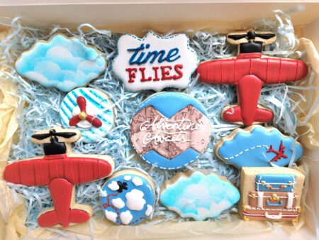 Advanture awaits airplane clouds time flies anniversary baby shower reveal  it's  a boy girl blue red  pastel colors suitcase  cookies