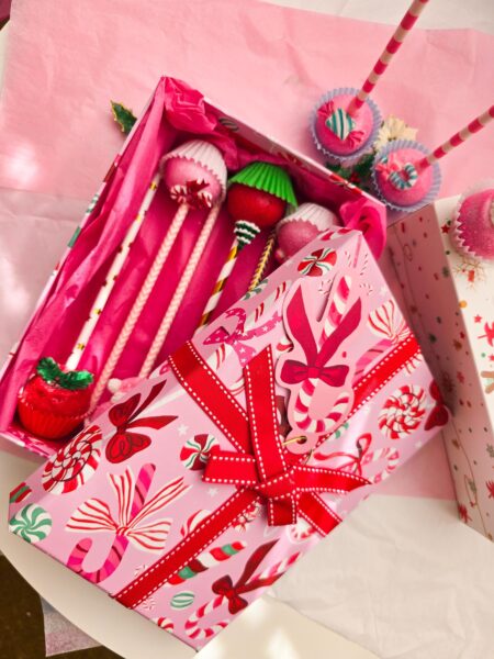 Christmas cake pops red green pink blue detailed annyversary cake pop on a stand individually wrapped