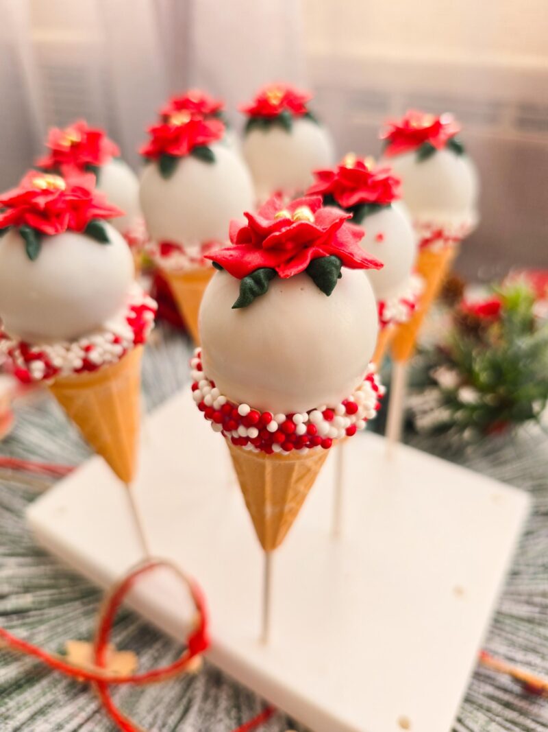 Poincettia christmas cake pops red green icecream cones detailed annyversary cake pop on a stand individually wrapped - Image 4