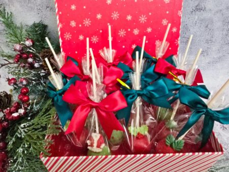 Christmas cake pops red green pink blue detailed annyversary cake pop on a stand individually wrapped